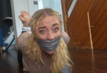 Zoey Ziptie Tightly Gagged and Hogtied by the Plumber – FrenchBondage Zoey’s gagged face in close-up, duct tape pressing over bulging sock gag
