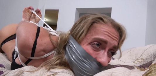 Buff Blondi Bound and Gagged on Her Bed – Bound To Be GAGGED 8-buff-blondi-silver-duct-tape-gag-toe-tied-hogtie-closeup-boundtobegagged