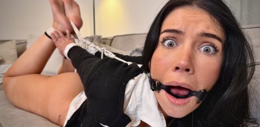 Tatti Debt Collector Ring Gagged Fucked Hard & Creampied In Hogtie – Tatti Roana Bondage Tatti with wide shocked eyes and ring gag drooling heavily while her bound legs are held high on the sofa – Tatti Roana Bondage