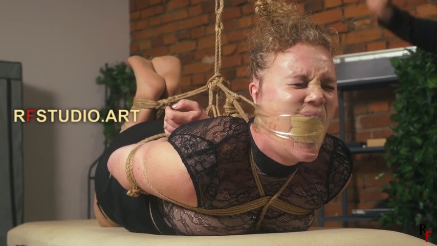 Close on Vanda's face with the nose hook pulling her open
