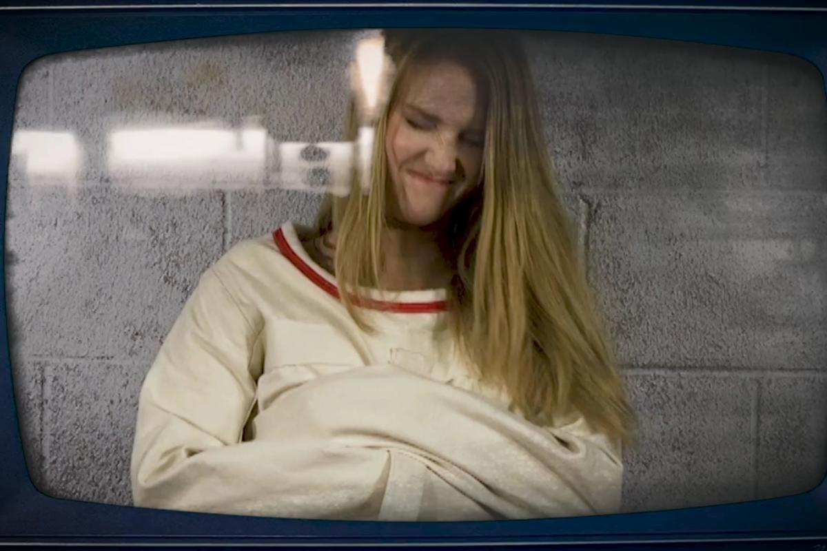 Ashley-Lane-tape-gagged-in-straitjacket-bondage-1