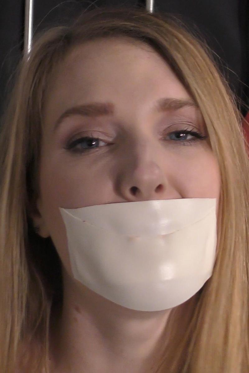 Ashley-Lane-tape-gagged-in-straitjacket-bondage-10