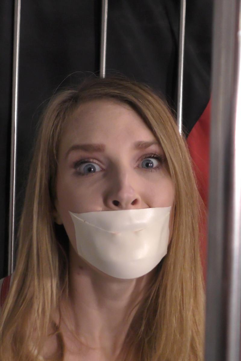 Ashley-Lane-tape-gagged-in-straitjacket-bondage-11