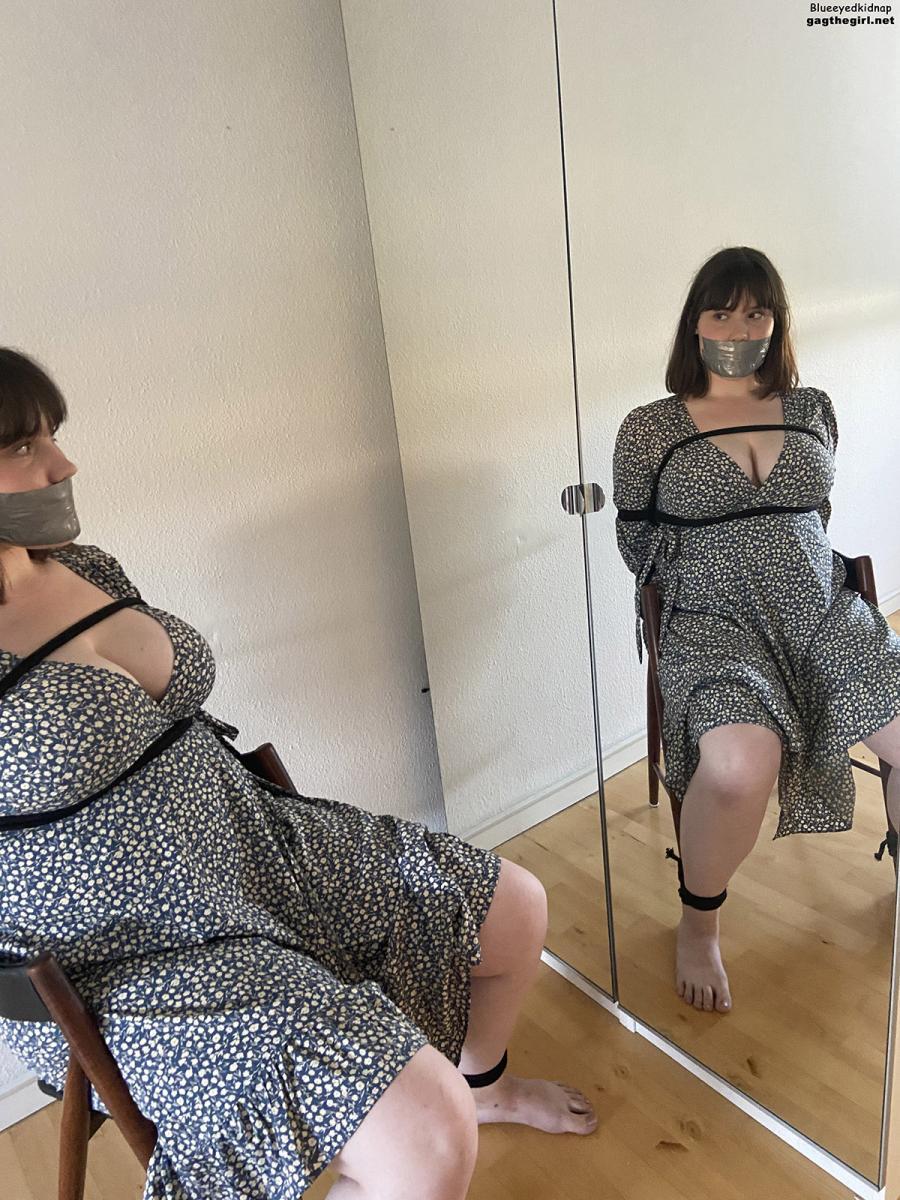 Woman with big tits tape gagged in rope bondage