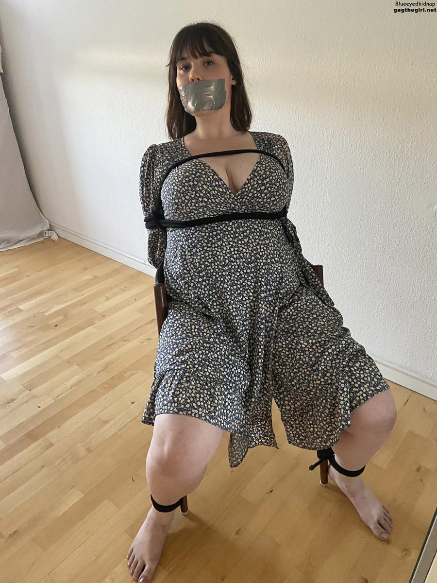 Woman with big tits tape gagged in rope bondage