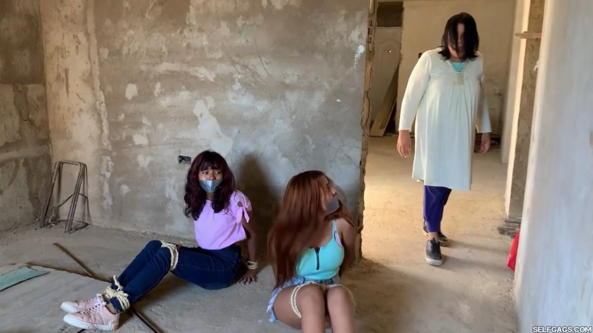 Curious-Sisters-Rope-Bound-And-Tape-Gagged-By-Crazy-Woman-In-Abandoned-House-2
