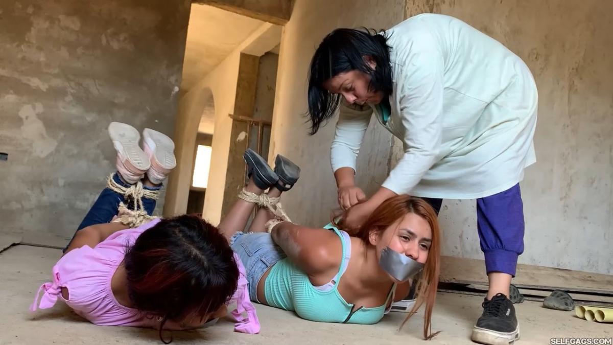 Curious-Sisters-Rope-Bound-And-Tape-Gagged-By-Crazy-Woman-In-Abandoned-House-2