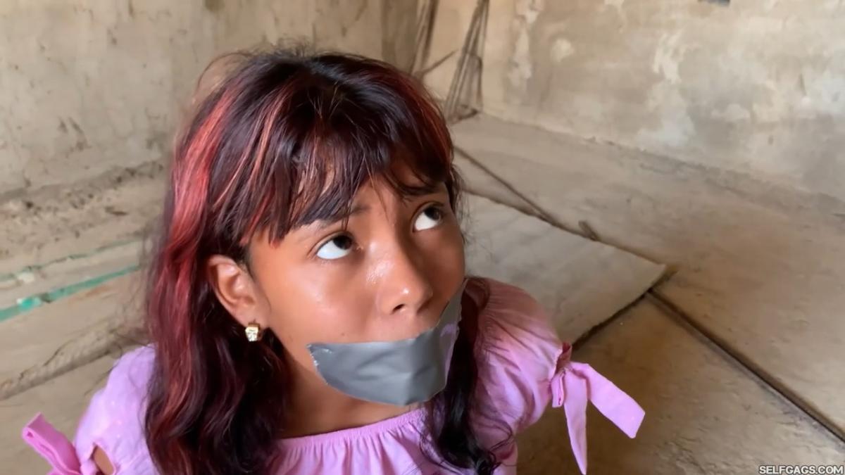 Curious-Sisters-Rope-Bound-And-Tape-Gagged-By-Crazy-Woman-In-Abandoned-House-2
