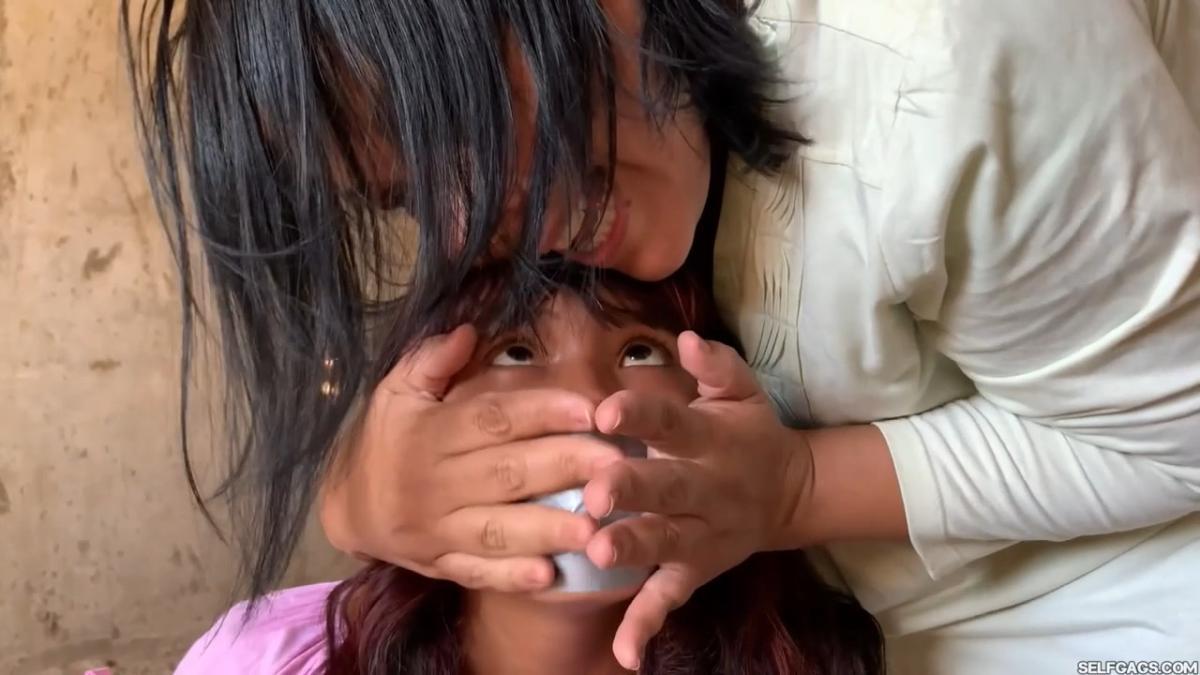 Curious-Sisters-Rope-Bound-And-Tape-Gagged-By-Crazy-Woman-In-Abandoned-House-2