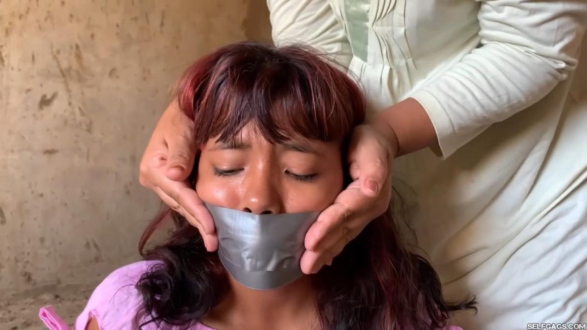 Curious-Sisters-Rope-Bound-And-Tape-Gagged-By-Crazy-Woman-In-Abandoned-House-2