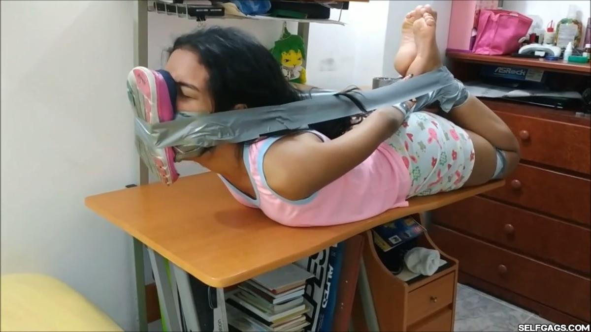 Cute-Babysitter-Hogtied-With-Shoe-Tied-To-Her-Face-39