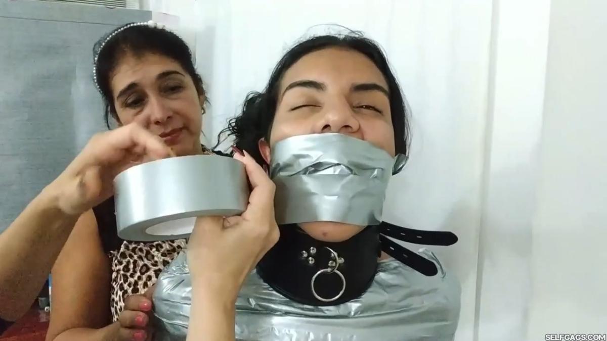 Girl-Mummified-By-Two-MILFs-18