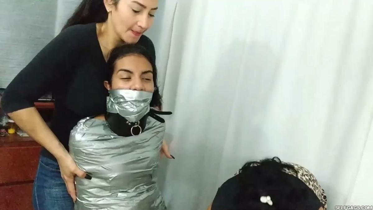 Girl-Mummified-By-Two-MILFs-20