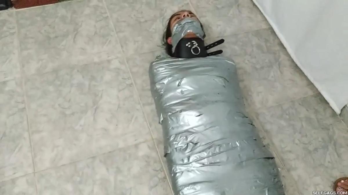 Girl-Mummified-By-Two-MILFs-21