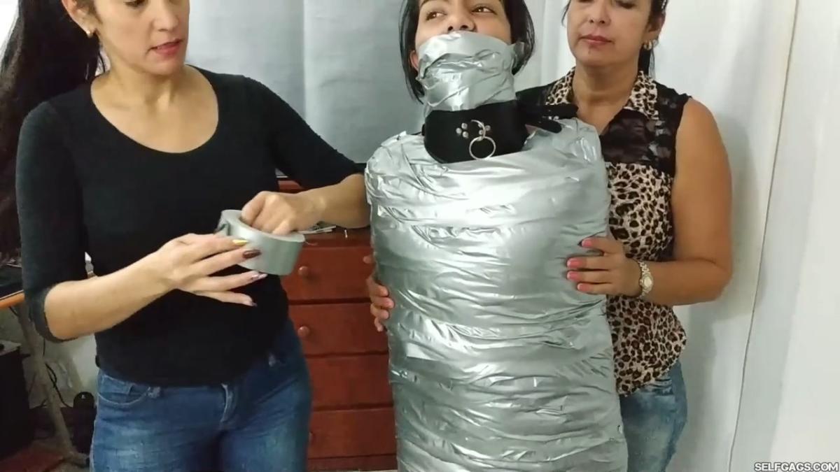 Girl-Mummified-By-Two-MILFs-31