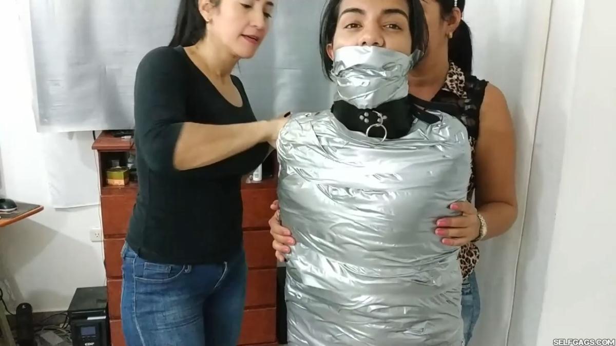 Girl-Mummified-By-Two-MILFs-32