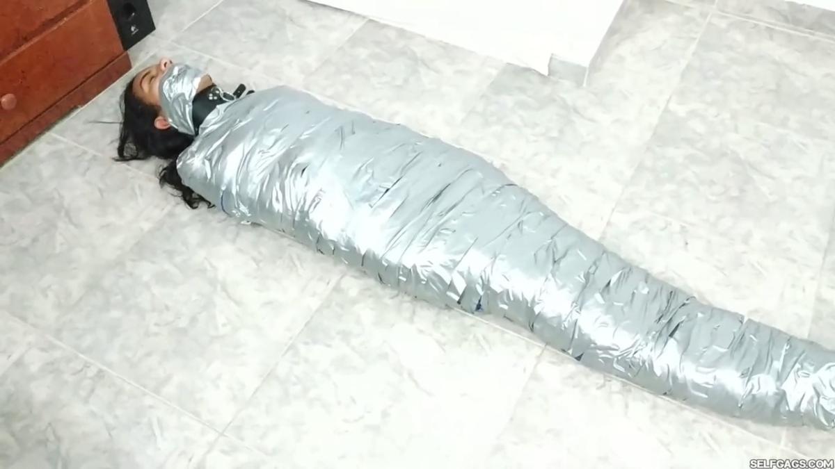 Girl-Mummified-By-Two-MILFs-36