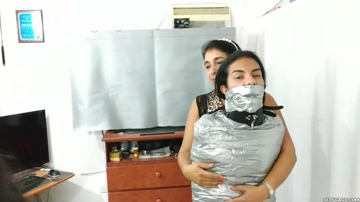 Girl-Mummified-By-Two-MILFs-38