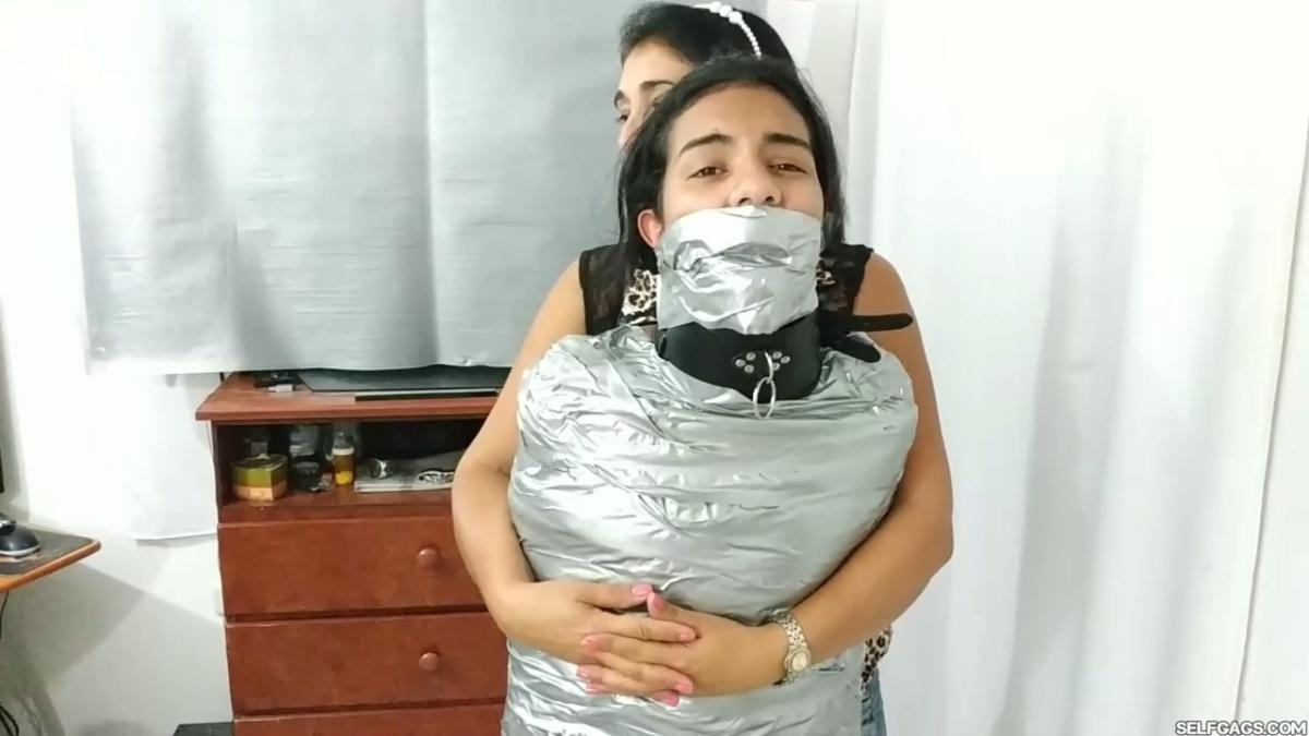 Girl-Mummified-By-Two-MILFs-39