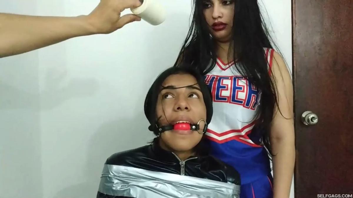 girl in catsuit bound and gagged by witch and cheerleader for halloween