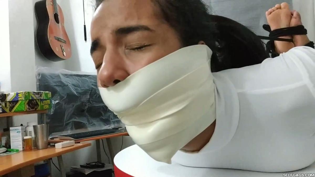 Hogtied-On-Table-With-Microfoam-Wrap-Gag-18