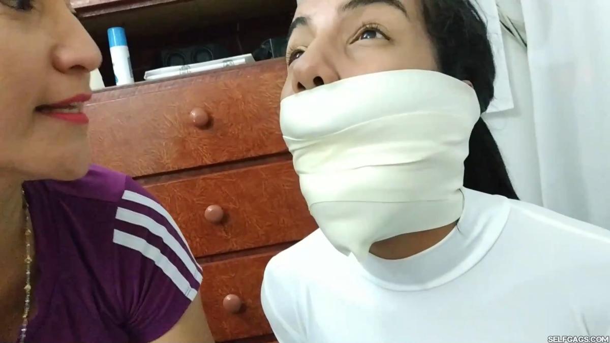 Hogtied-On-Table-With-Microfoam-Wrap-Gag-8