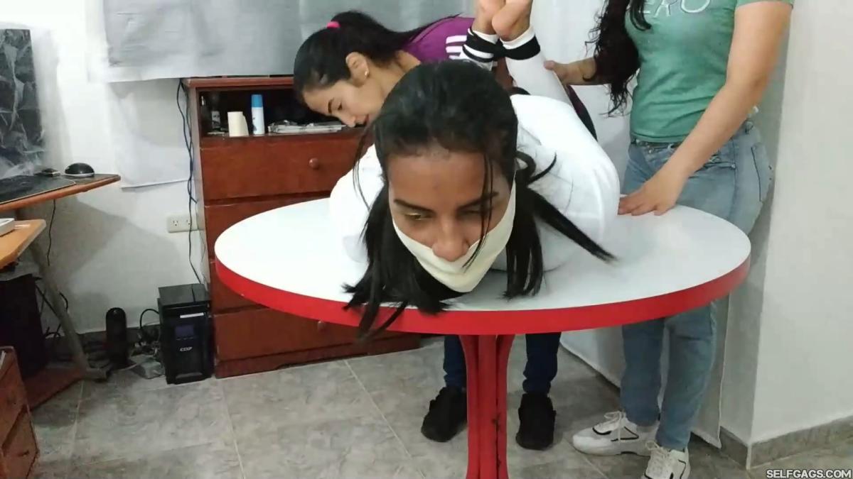 Hogtied-On-Table-With-Microfoam-Wrap-Gag-9
