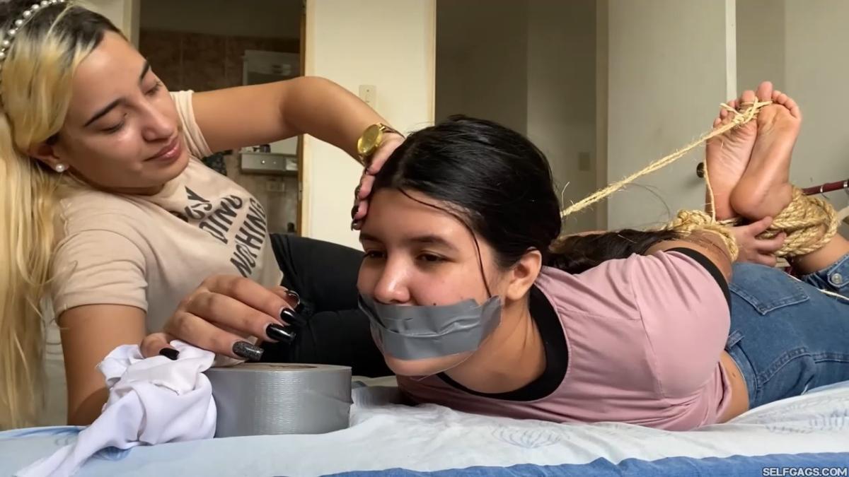 Lesbian-Bondage-Girl-Gagged-And-Hogtied-By-New-Neighbor-17