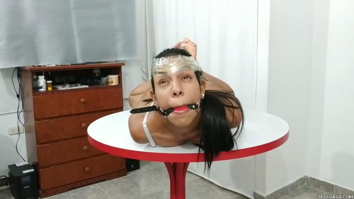 Maria-Martinez-Hogtied-During-Dice-Bondage-Game-1