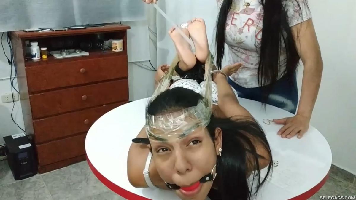 Maria-Martinez-Hogtied-During-Dice-Bondage-Game-12