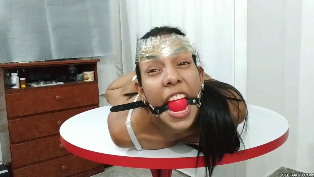 Maria-Martinez-Hogtied-During-Dice-Bondage-Game-2