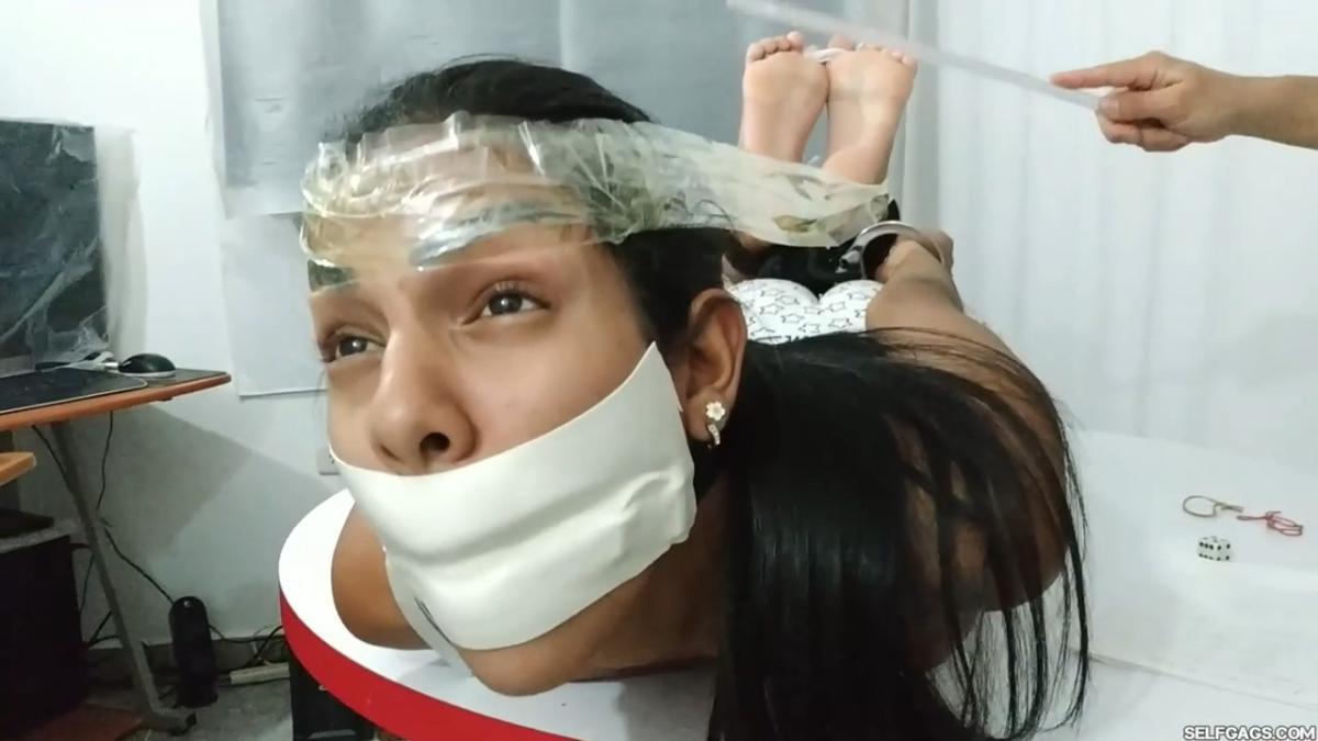 Maria-Martinez-Hogtied-During-Dice-Bondage-Game-20