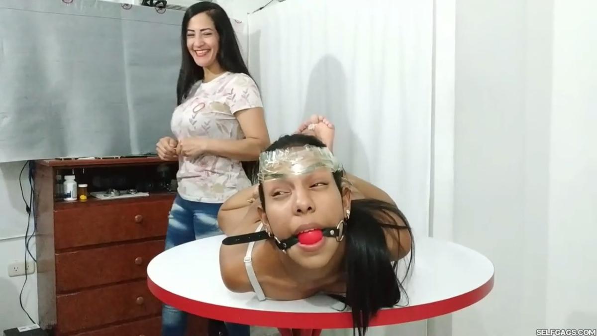 Maria-Martinez-Hogtied-During-Dice-Bondage-Game-3