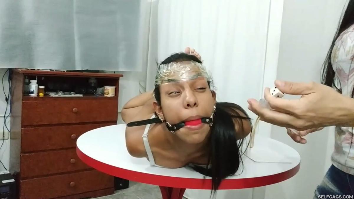 Maria-Martinez-Hogtied-During-Dice-Bondage-Game-5