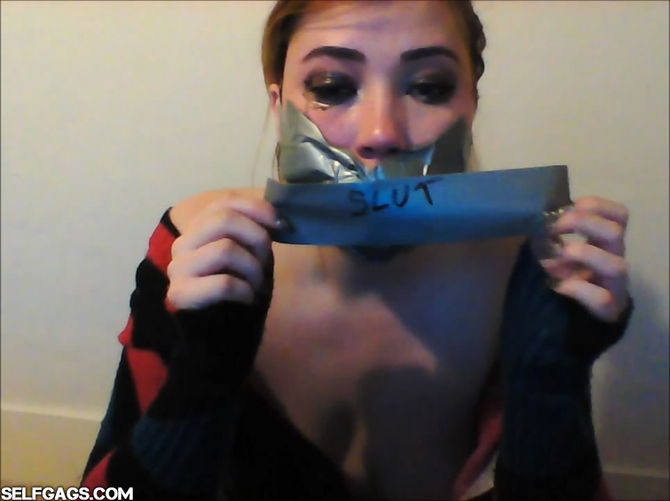 Misha Mayfair tape gagging herself for Selfgags