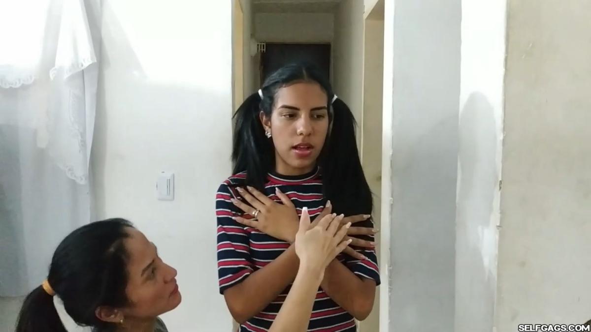 Cute girl gets duct tape mummified BDSM training by female bondage photographer
