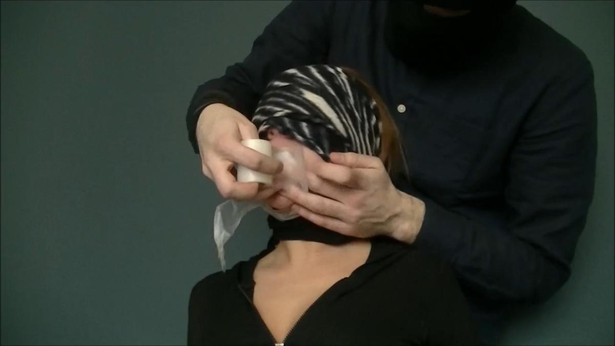 Blindfolded college girl gagged