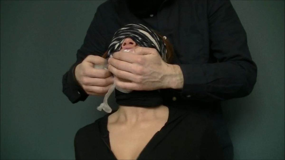 Blindfolded college girl gagged