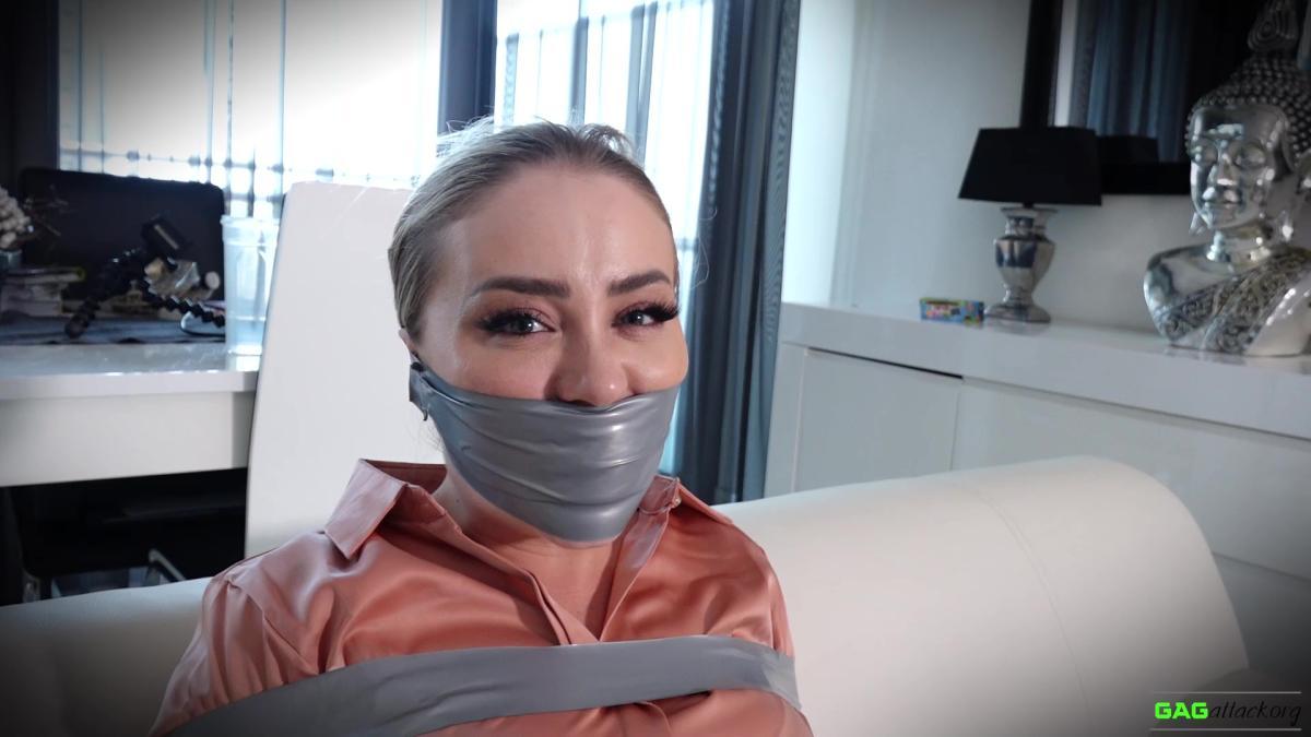 Secretary-in-Tape-Bondage-Aubrey-Gag-Attack-4