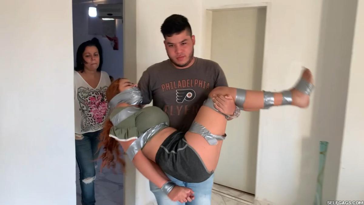 Tape-Bound-Girl-Gagged-In-Barrel-9