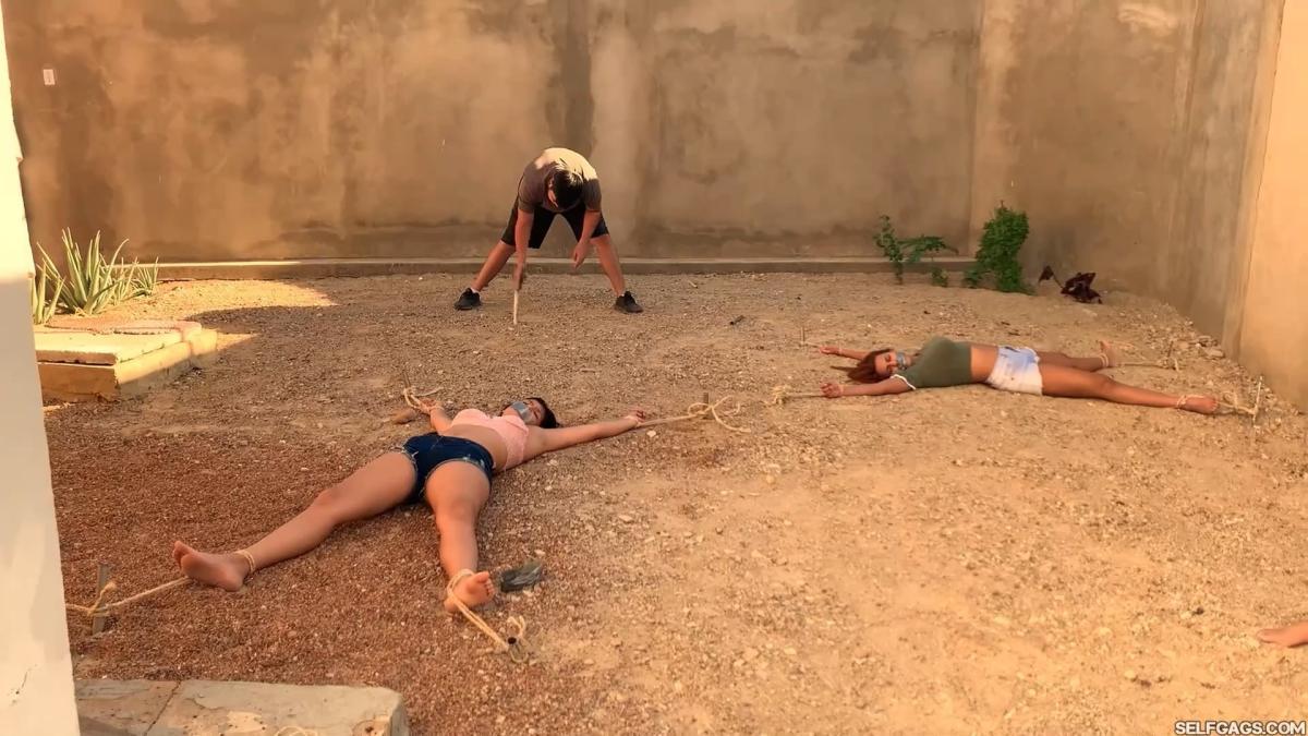 Three-Hot-Girls-Spreadeagle-In-Stakeout-Bondage-12