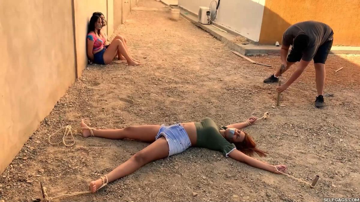Three-Hot-Girls-Spreadeagle-In-Stakeout-Bondage-8
