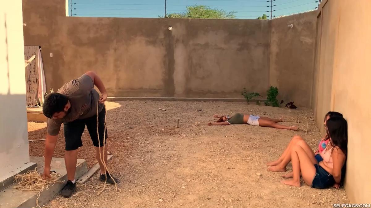 Three-Hot-Girls-Spreadeagle-In-Stakeout-Bondage-9