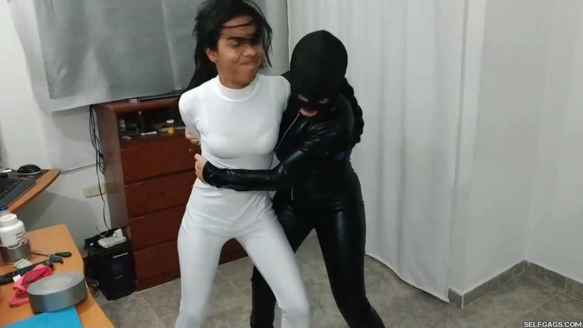 Catsuit girl in bondage