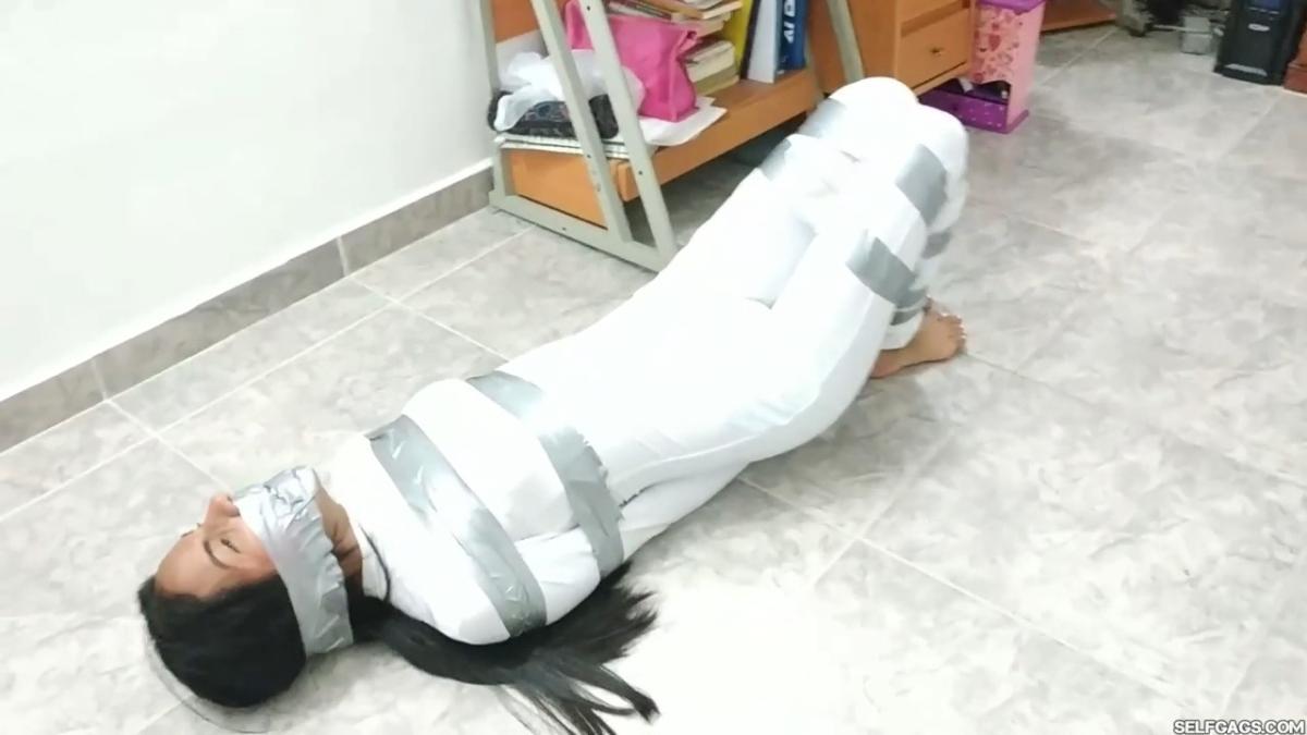 Catsuit girl in bondage