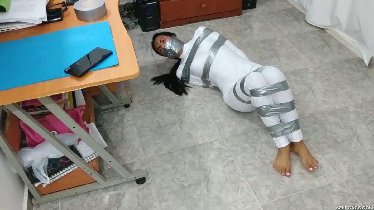Catsuit girl in bondage