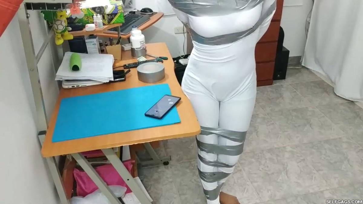 Catsuit girl in bondage