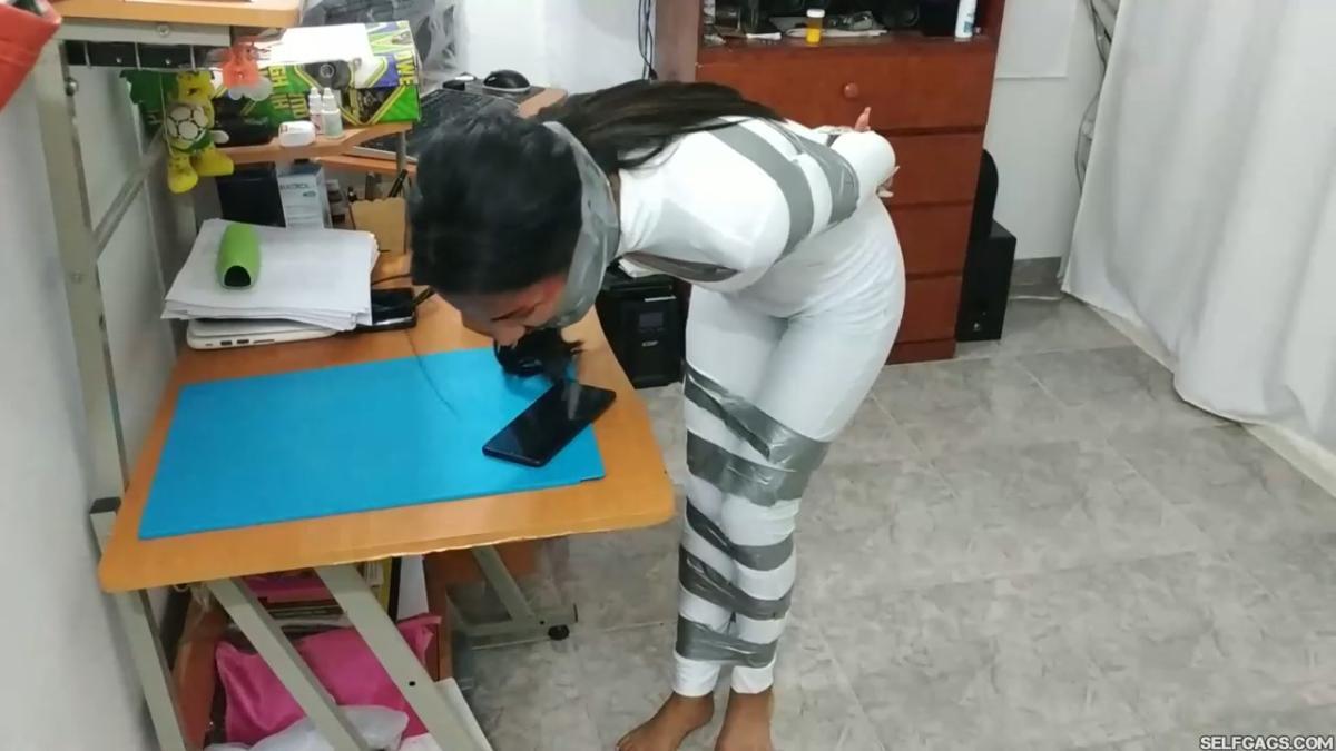 Catsuit girl in bondage