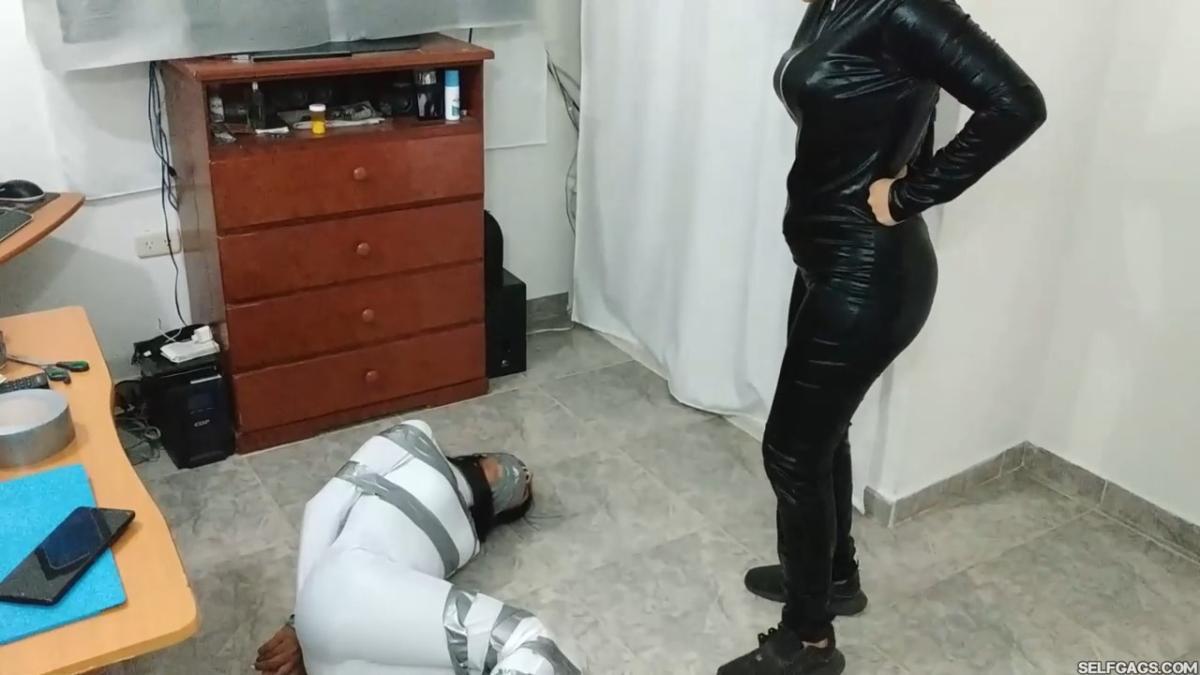 Catsuit girl in bondage