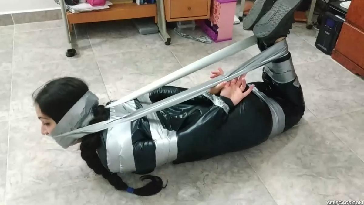 Catsuit girl in bondage